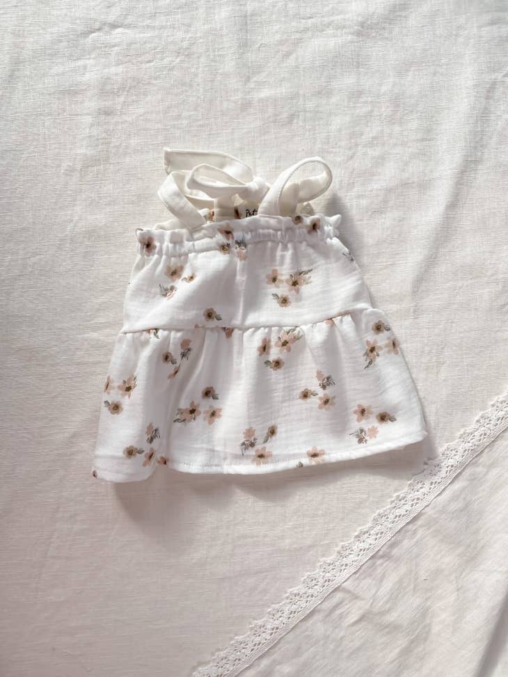 Vestido de bebé em musselina floral (-50%)