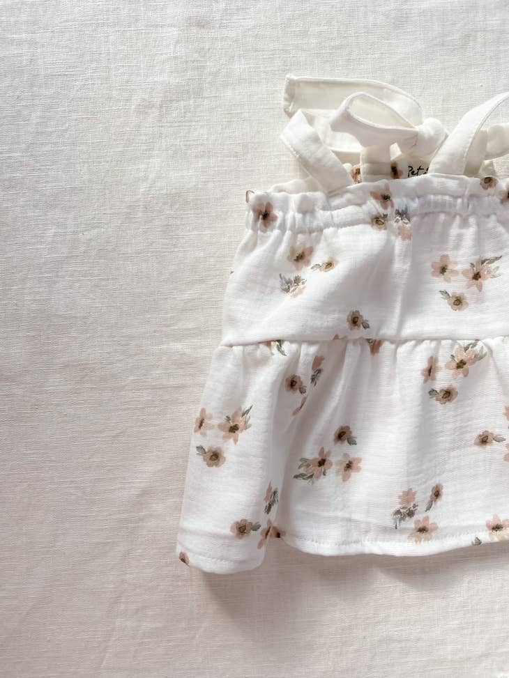 Vestido de bebé em musselina floral (-50%)